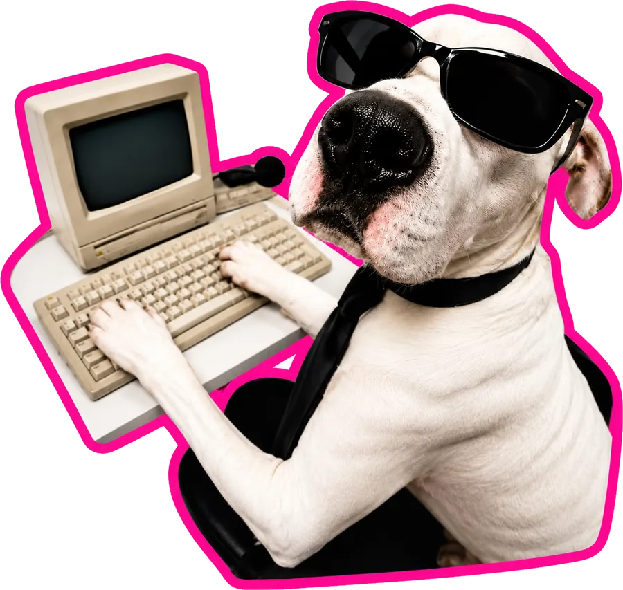 Dog in sunglasses and a tie typing on a vintage computer
