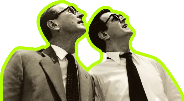 Two businessmen in glasses looking up